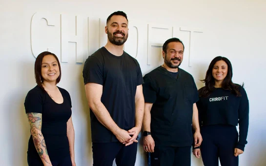 Chiropractor Chatsworth CA Shane Young With Team In Front of Sign Chiropractor Chatsworth CA Shane Young With Team In Front of Sign